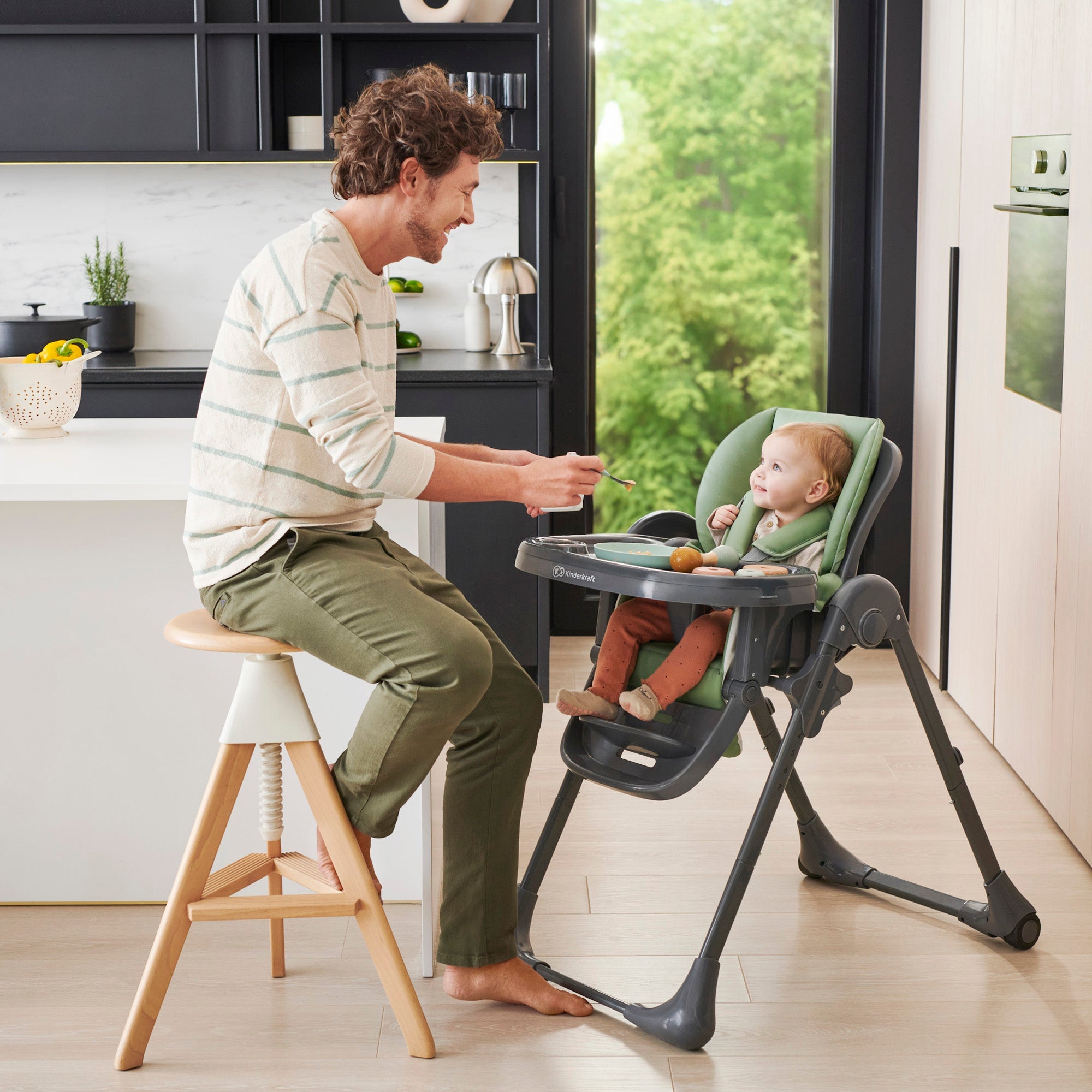 Kinderkraft Tummie high chair with baby, Green lifestyle